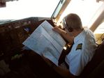 ATA First officer studying aero charts