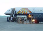 ATA Airlines Military Charter Passengers deplane...